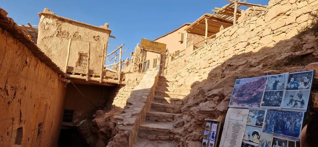 Narrow passage between earth-coloured village walls