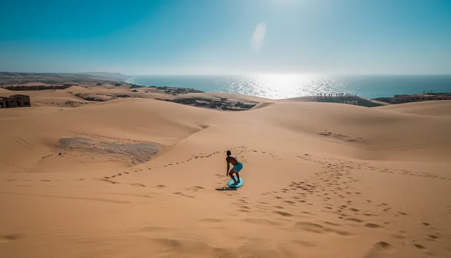 A walker among broad dunes beside the Atlantic