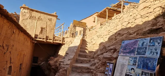 Narrow passage between earth-coloured village walls