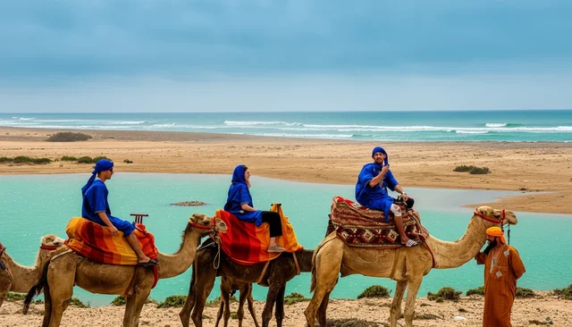Camel riders crossing a beach beside the Atlantic