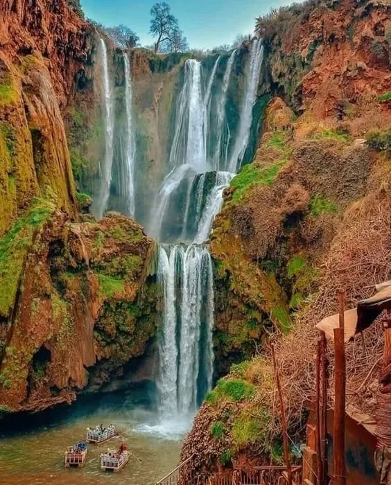 Water cascading down rock and greenery at Ouzoud